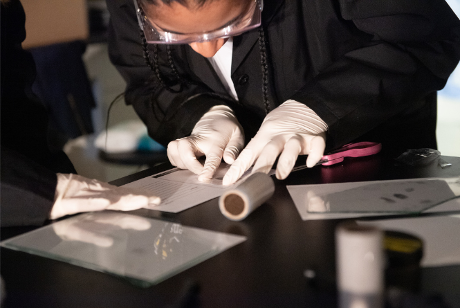 USM Student doing a fingerprint analysis